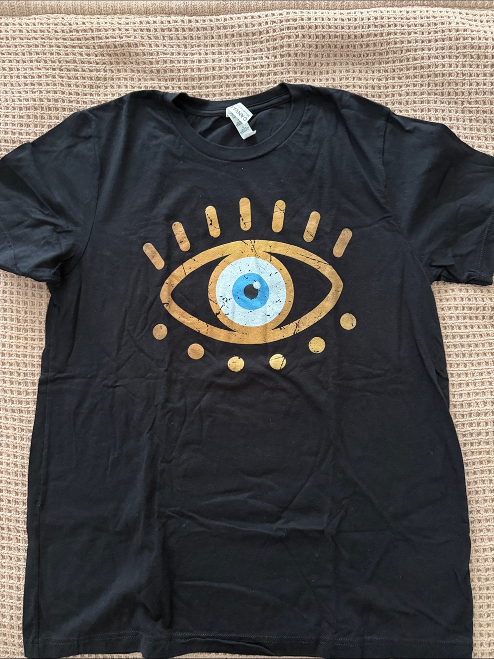 H&M Black T‑Shirt with Gold and Blue Eye Graphic